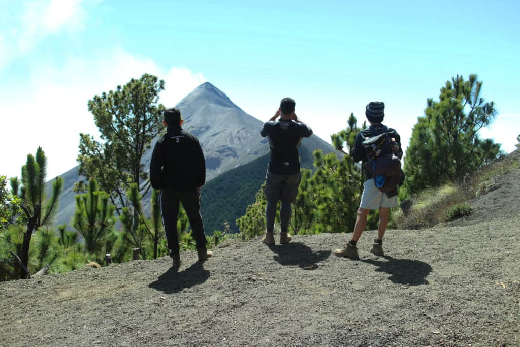 threesome on looking at Fuego volcano during Acatenango hike tour