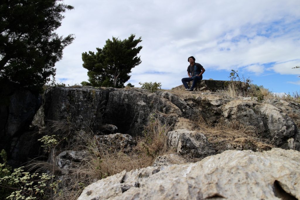A friend sitting near the edge of the Hoyo de Cimarrón in Nentón Huehuetenango Guatemala