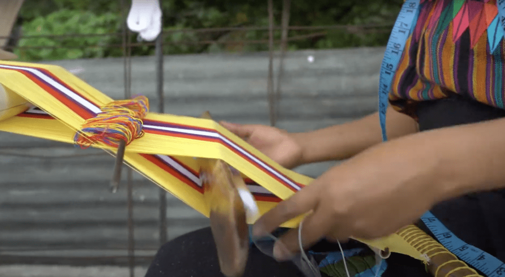 Woman in Santa Cruz la Laguna weaving on a backstrap loom