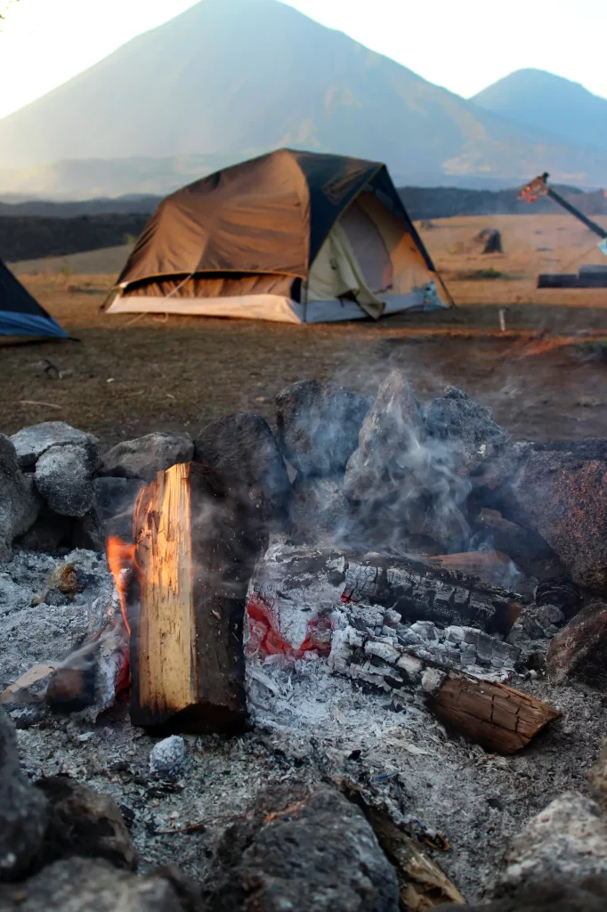 Tent and Bonfire at El Amate in Guatemala with Pacaya volcano just visible in the background