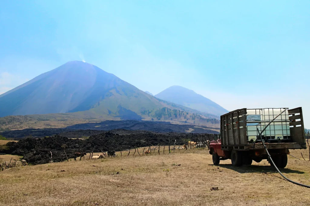 Water truck at Finca el Amate with Pacaya Volcano in the background
