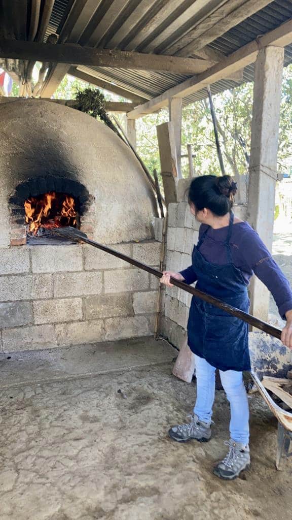Making bread in a wood fired oven in Panimatzalam, Guatemala on Easter Wednesday.